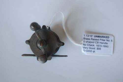 1 13/16 UNMARKED Brass Raised Pillar Reel No. 6. 7/8 in. pillars. No Check; Wood knob on S-shaped counterbalanced crank handle; Marked 6 on foot. Circa 1870-1890. 3 3/8 oz.
